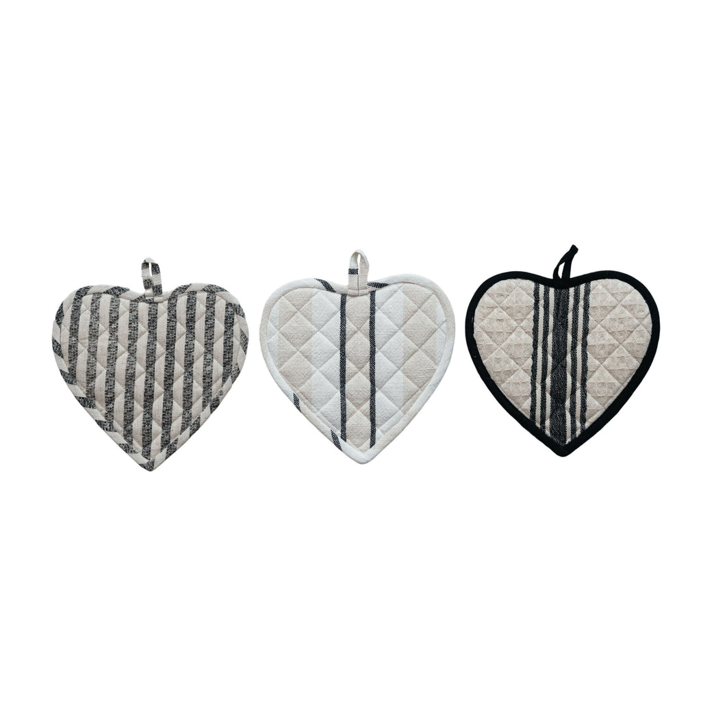 Three heart-shaped pot holders with different patterns on a white background