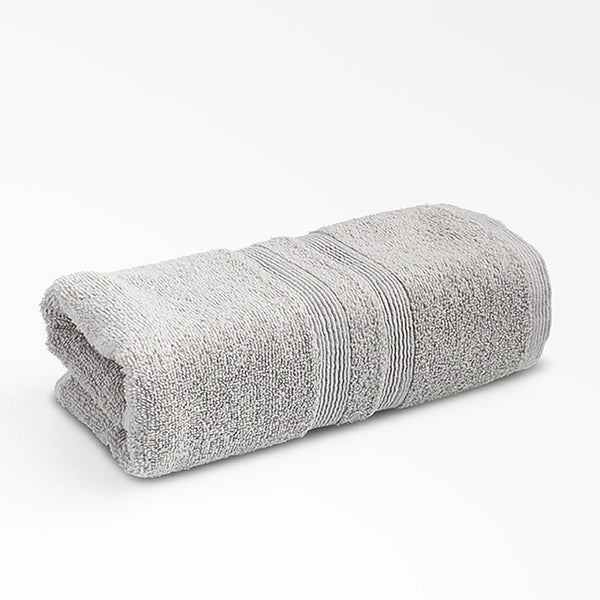 Moda At Home Allure Cotton Hand Towel, in marble grey, folded.