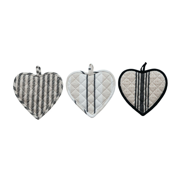 Three heart-shaped pot holders with different patterns on a white background