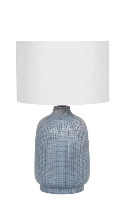table lamp with dark sage green ceramic base and white linen shade.