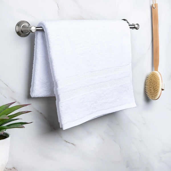 Moda At Home Allure Cotton Bath Towel in White, hanging.
