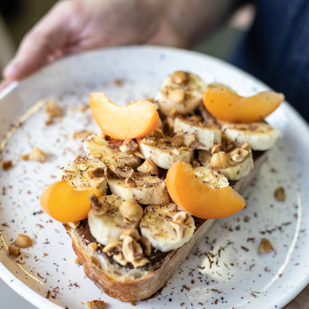 Allo Simonne Hazelnut and Jaguar Chocolate, on toast with bananas, crushed hazelnuts, chocolate shavings and apricot slices.