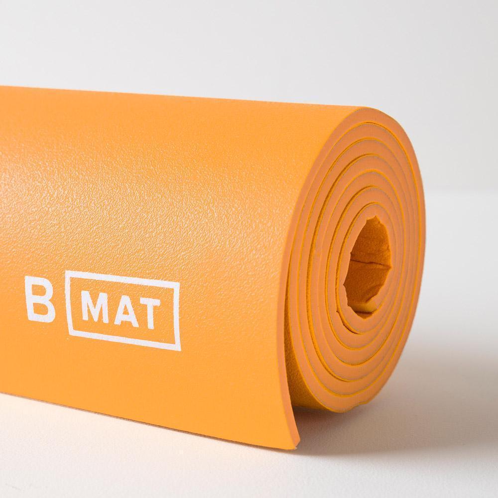 Halfmoon B Yoga Strong Mat 6mm, in saffron, close up.