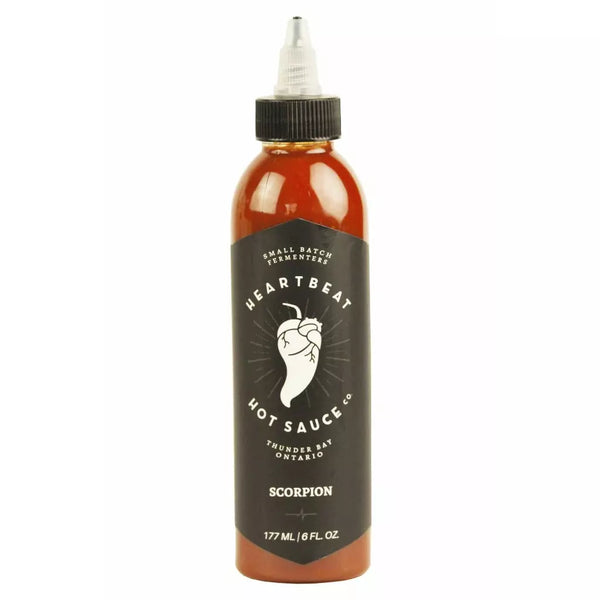 Heartbeat Hot Sauce Scorpion sauce, in bottle, close up.
