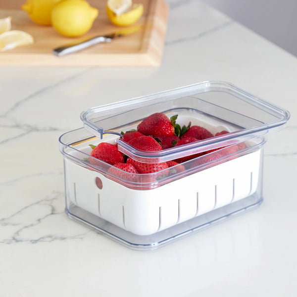 Idesign Crisp Berry Container, clear, in use, with strawberries.