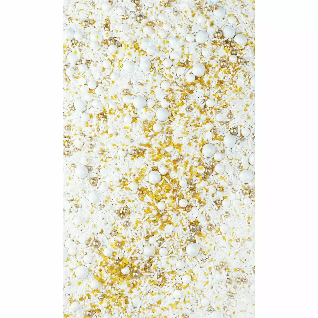 Frosted sprinkles close up, in white, yellow gold, and yellow.