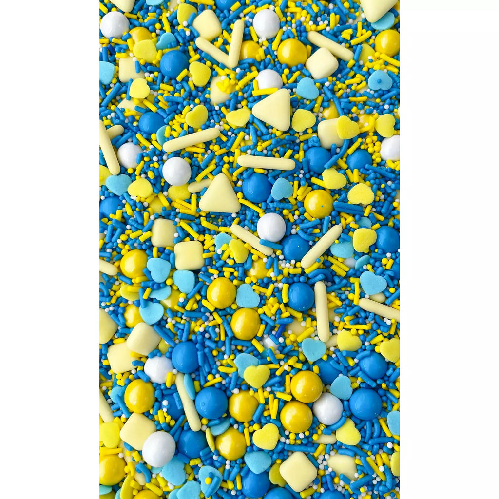 Close up of Hearts for Ukraine sprinkle medley,blue and yellow heart confetti, matte shapes, and pressed sugar with a candy shell shapes. 