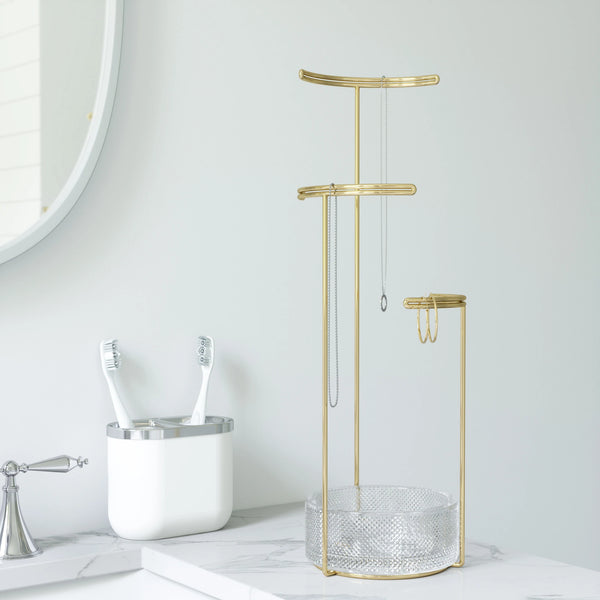 Tesora jewelry stand, gold with glass bottom, styled in bathroom.