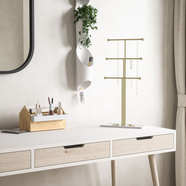Umbra Trigem White and Brass Jewelry Stand styled in use.